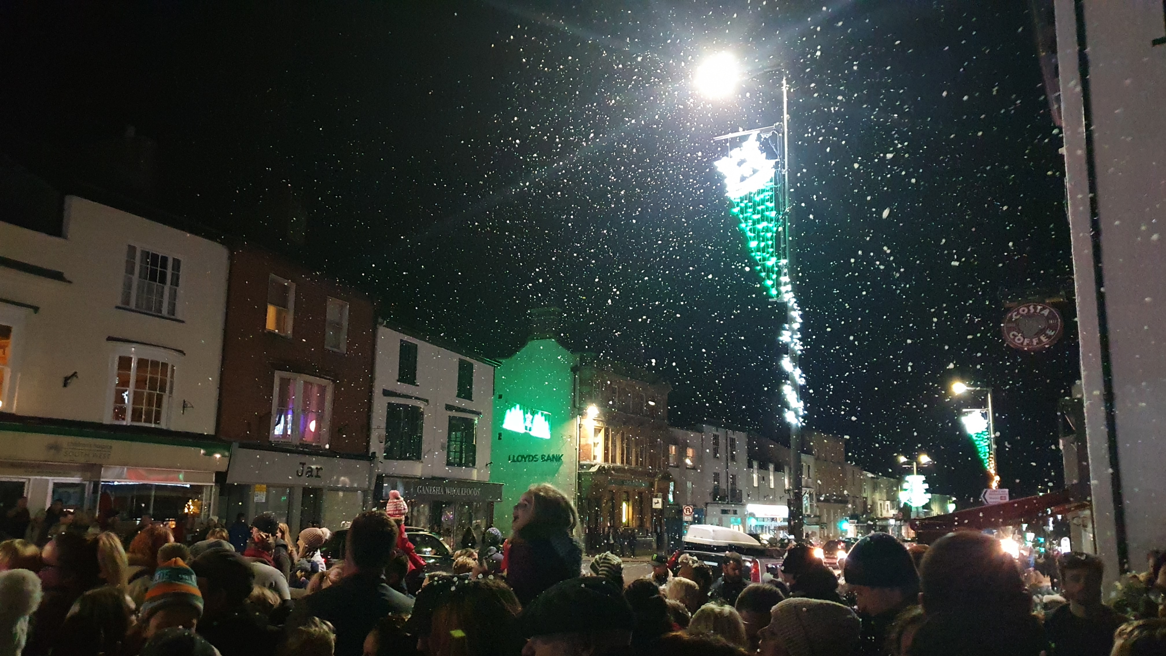 Honiton High Street lit up with Christmas Lights and snow