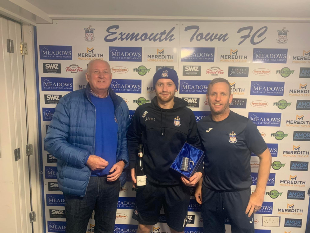 Arron Denny, centre, being presented Man of the Match and an award for his 200th appearance (Exmouth Town FC)