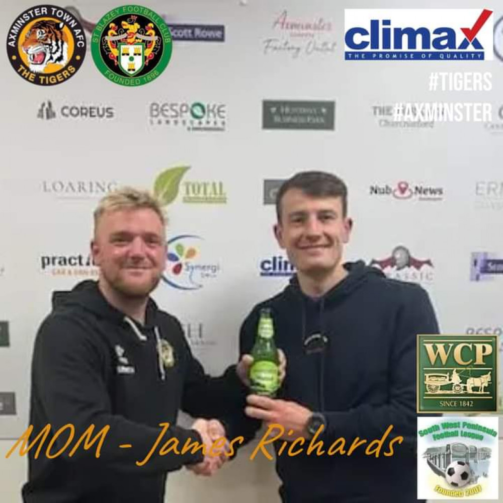 Axminster groundsman Jamie Barefoot presents the man-of-the-match award to James Richards after the 2-1 win over St Blazey