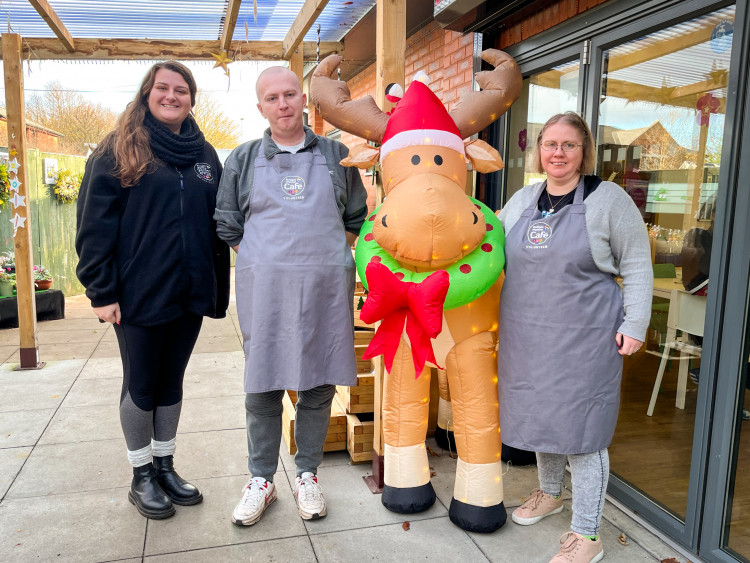 Mr C and Kerry, two of the people Autism Together supports with Bromborough Pool Garden Centre manager Emma Crabb.