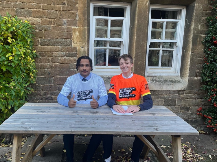 Jono (right) and a friend wearing the challenge t-shirts (image courtesy of Oakham School)
