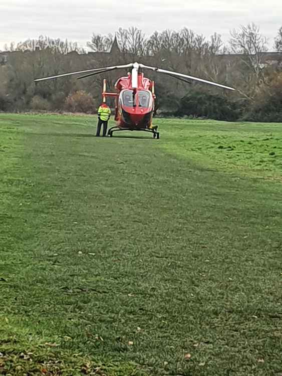 An air ambulance landing at the scene of the accident  Pic: Chris Pond