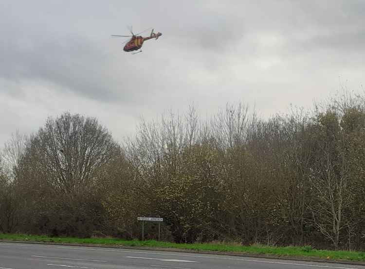 The air ambulance taking off from the scene