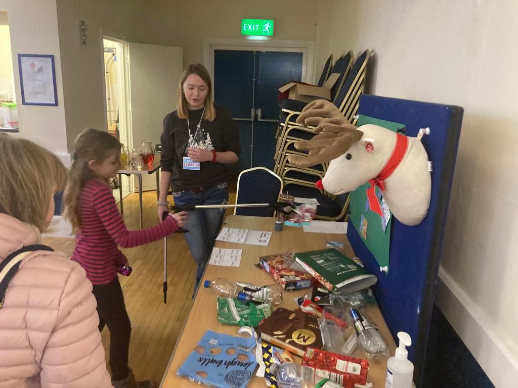 Millie Wilson, pupil of Axe Valley Academy, with a game designed to test knowledge of recycling