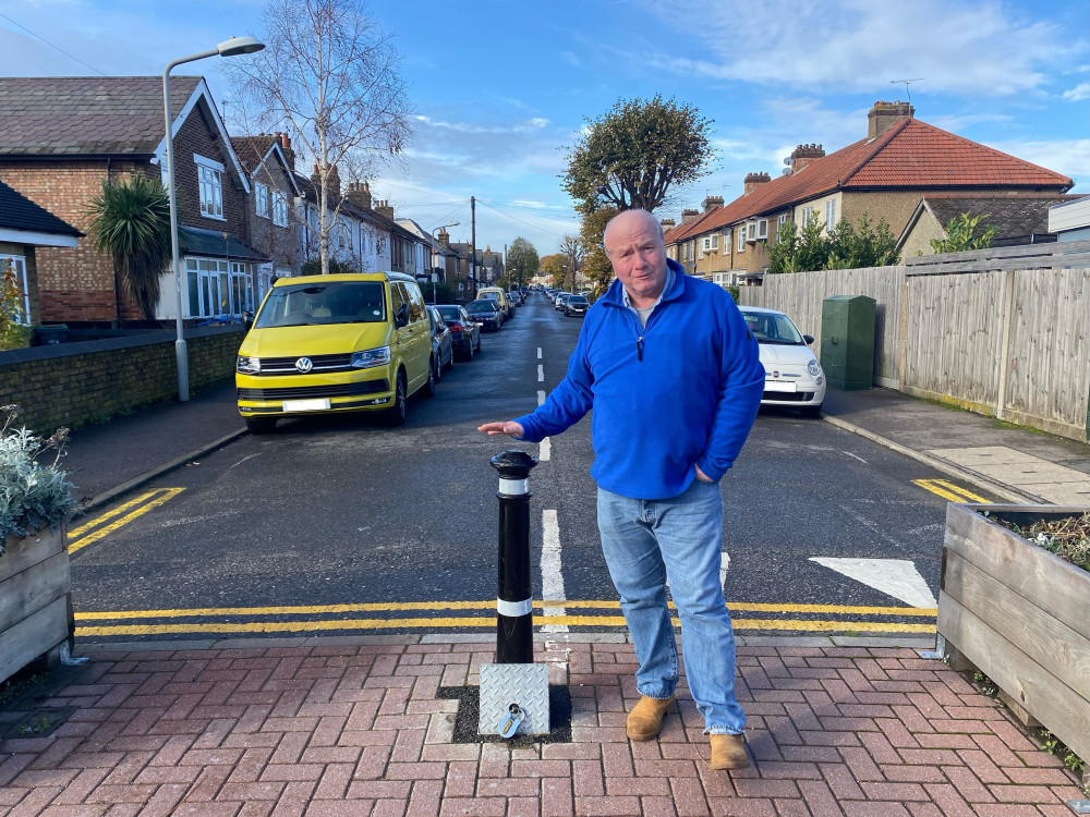 Rory Dunn, 61, with the bollard on Tolworth Road. Credit: Charlotte Lillywhite/LDRS