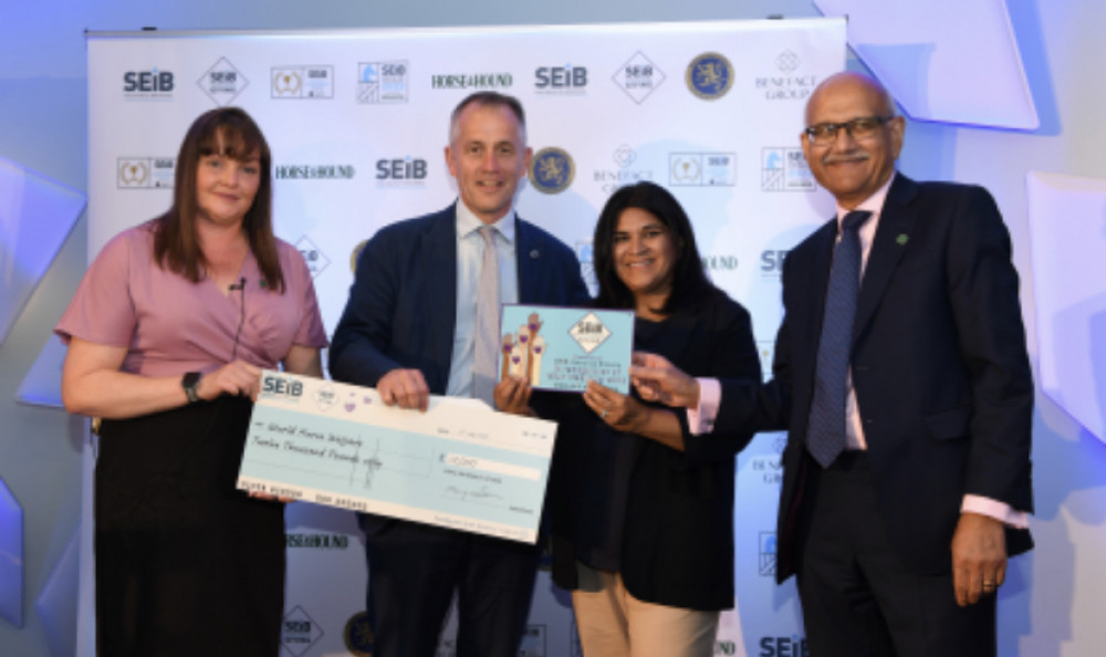 Suzy Middleton SEIB CEO, Rita Bajaaj Benefact Group Non-Executive Director and Bipin Thaker SEIB COO present the 2022 SEIB Giving top donation to Roly Owers CEO of leading equine welfare charity, World Horse Welfare. 