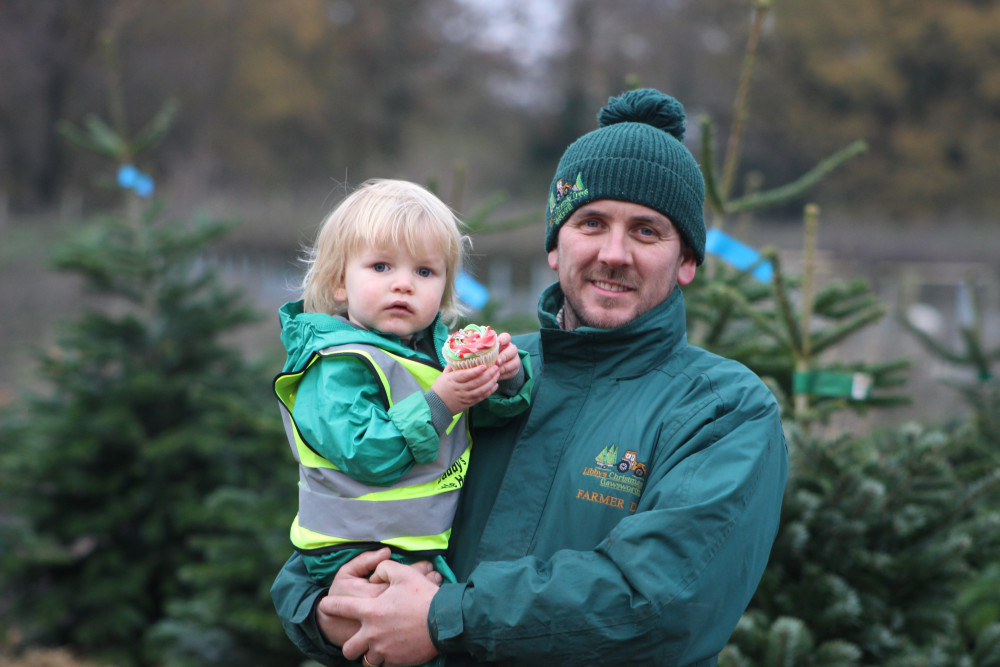 You'll be able to enjoy Christmas refreshments as you choose your tree at Libby's Patch. Image: Daniel Thornicroft with son Rupert. (Alexander Greensmith / Macclesfield Nub News)