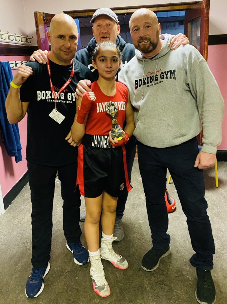 A teenage boxer who trains at a Leamington gym recorded an impressive victory at the weekend to add to her growing reputation. Pictured: Jaya with Coaches Roy Thornton, Russell Walley and Edwin Cleary. Photo Credit: Reece Singh PR.