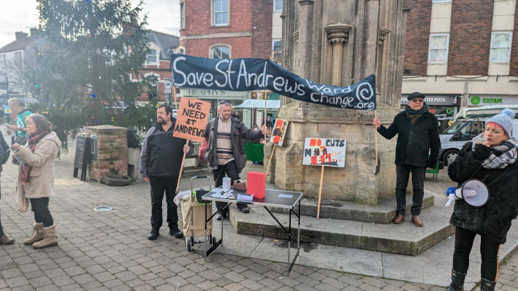 Local residents gather to protest about the closure of St Andrew's ward.