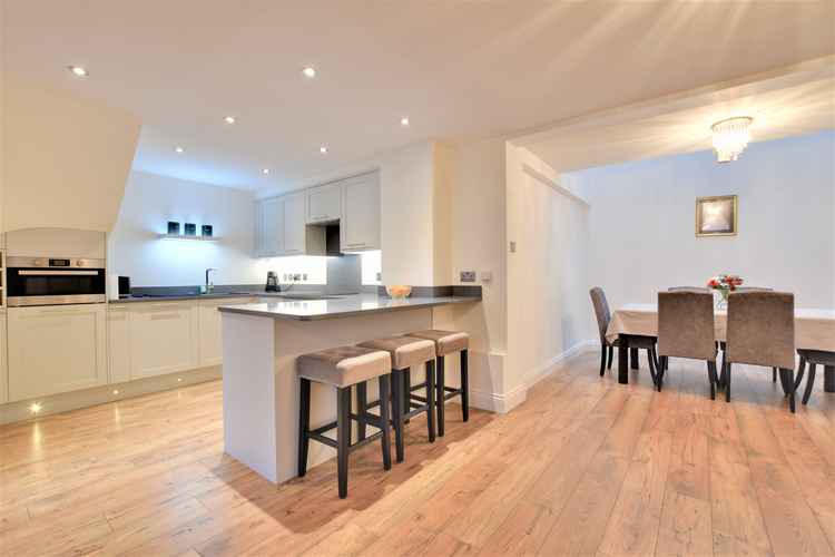 The high-specification kitchen looking towards the dining area The high-specification kitchen looking towards the dining area