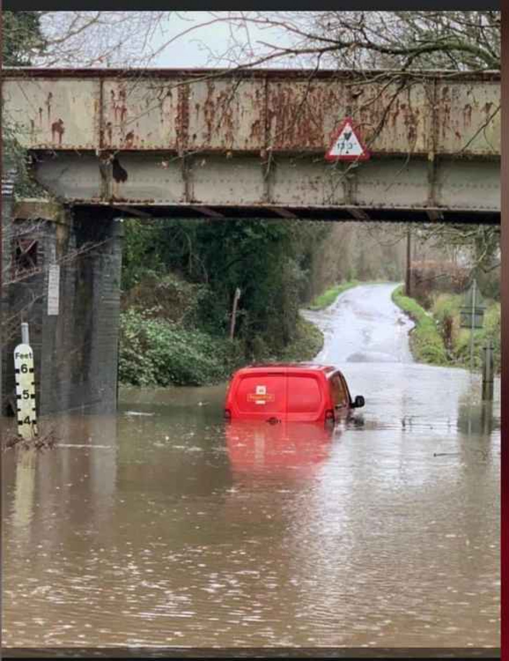 A Royal Mail van stranded in Ferry Road at Creeksea, Burnham