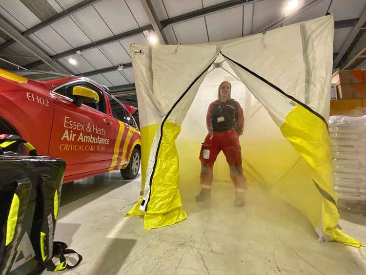 Air ambulance doctor Lisa Cunningham is decontaminated with 'dry fog'