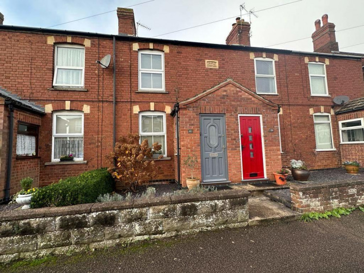 The property is a characterful terraced house (image courtesy of Moores Estate Agents).