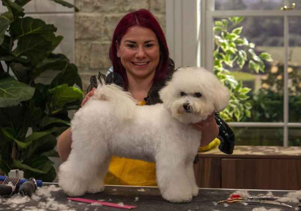 Hannah with Bichon Frise Winnie, one of the pooches she groomed on the very first show of the series