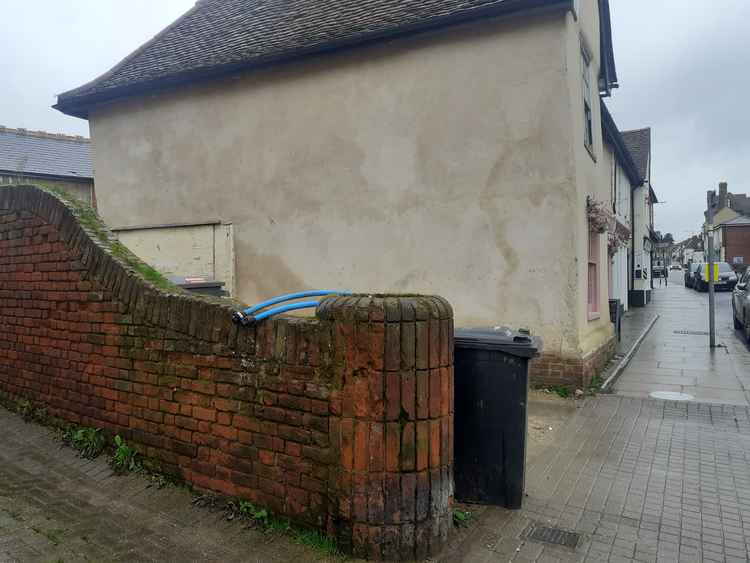 The round brick piers in the wall to the east of the Waffle Bar are of an early 20th Century design