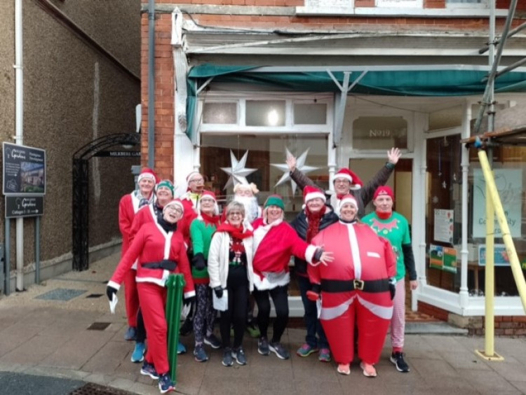 Axe Valley Runners dressed in Christmas costume to sing carols at local care homes