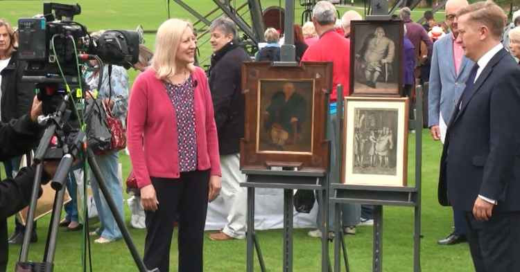 Lynne Raymond at the Antiques Roadshow in Audley End in 2016 with pictures of Edward Bright  Pic: Mike Kneller