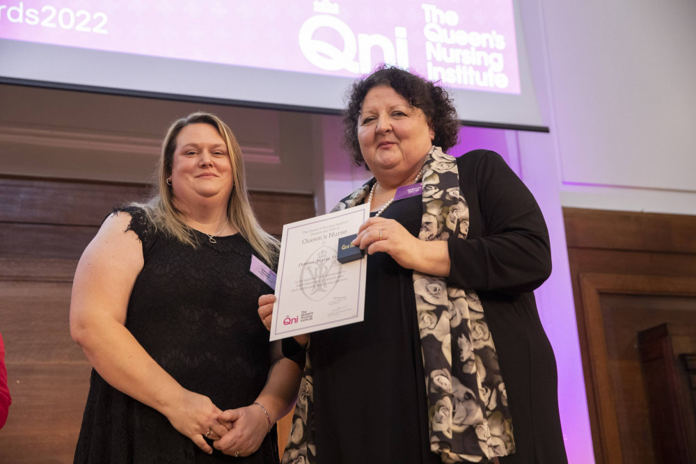 Donna Fraser (left) receivers her Queen’s Nurse certificate from Deborah Sturdy, the chief nurse for adult social care (image courtesy of Kate Stanworth).