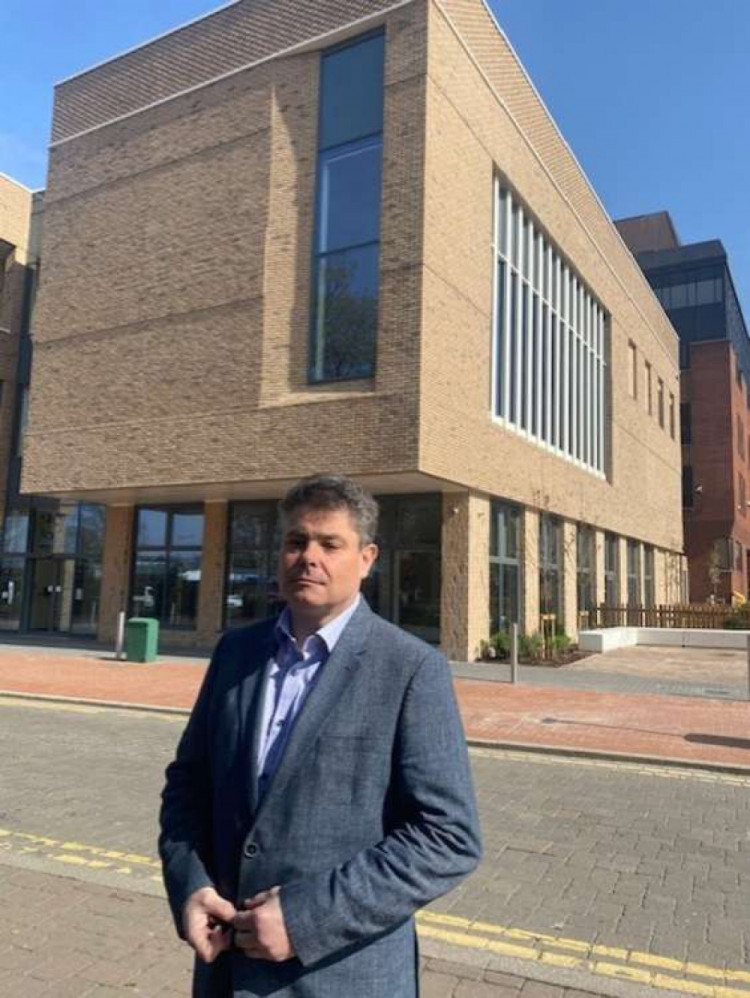 Cllr John Kent outside the controversial civic offices extension - now branded as the Town hall. 