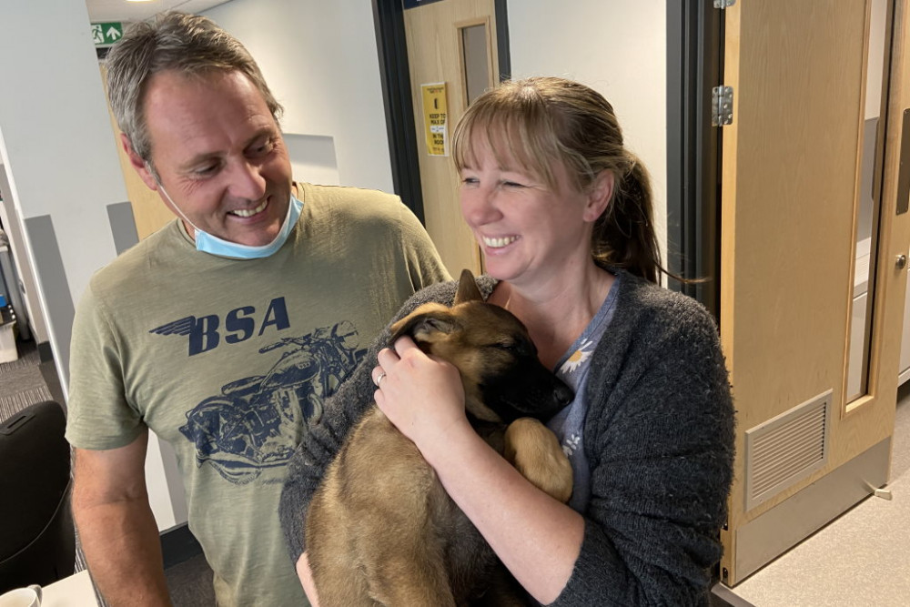 PC Dave Bridge and Sam Bridge with Police Dog Leo as a nine-week-old puppy in September