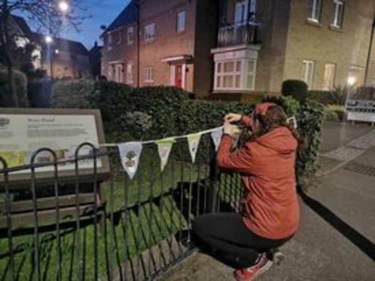 One of the Maldon Craftivism banners is put in place