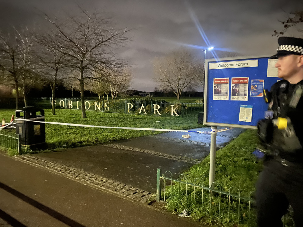 Police officers have cordoned off an area while a forensic examination takes place. 