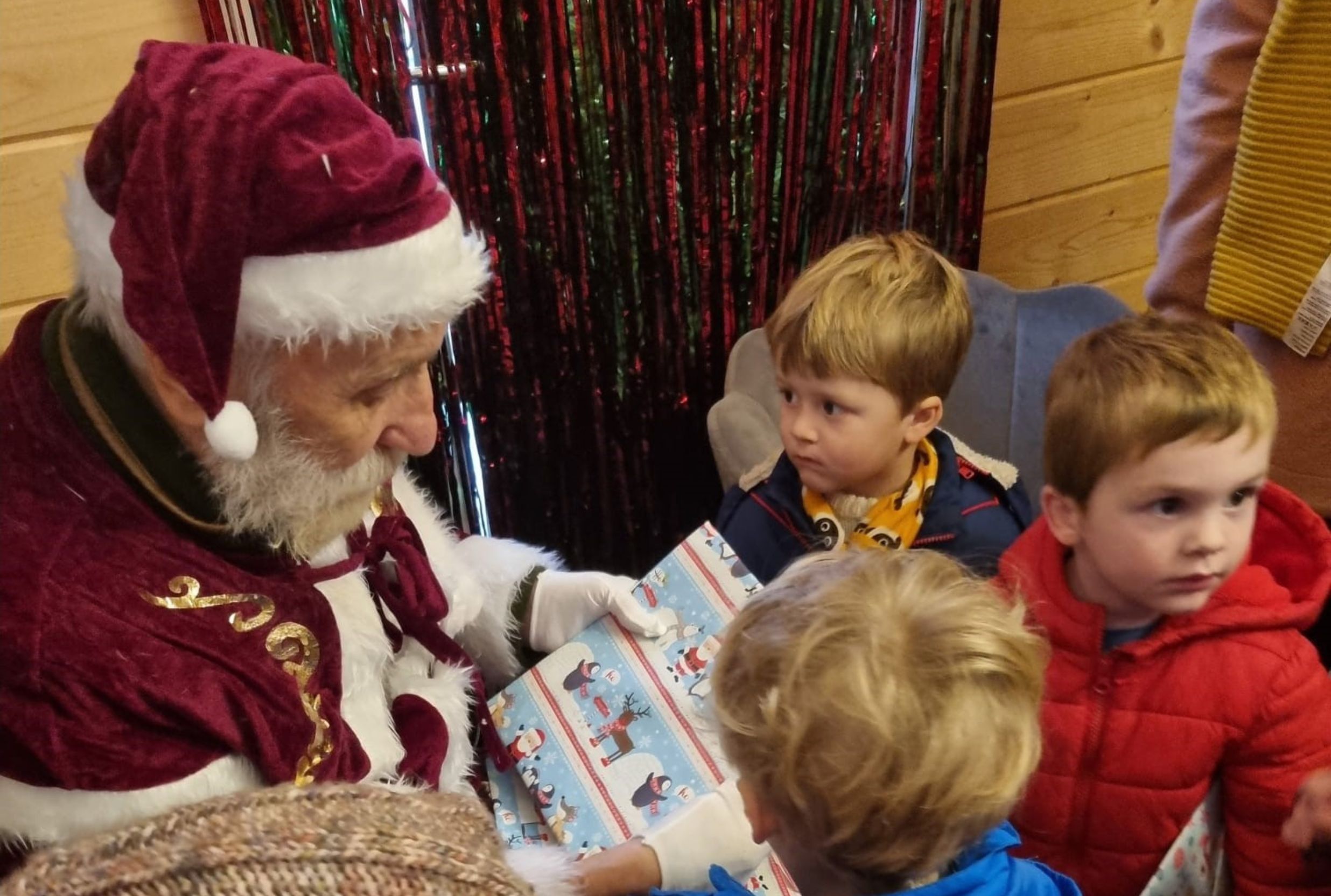 George giving out Christmas gifts (Doveleigh Care)