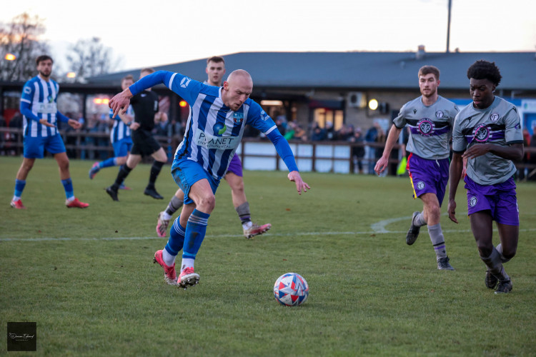 Sandbach United striker Josh Oultram prepares to shoot. Photography Credit: Duncan Edward