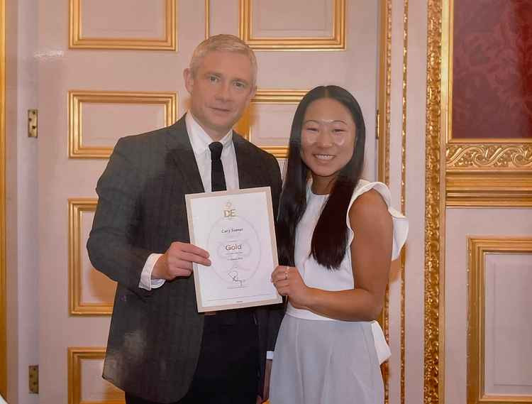 Lucy Soanes collecting her DofE award from guest presenter and actor Martin Freeman.