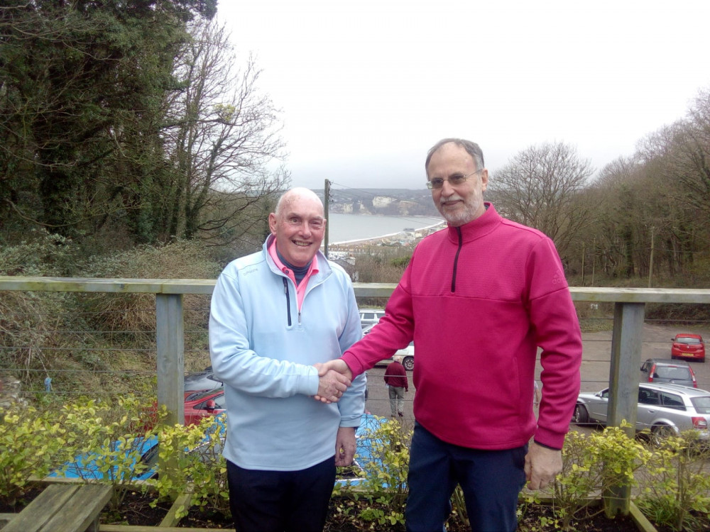 David Lacey (left) congratulating Steve Thompson outside our the Axe Cliff clubhouse overlooking Seaton Bay