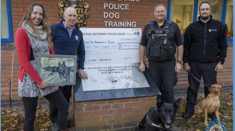 Police presented a cheque to Retired WMP Dog Benevolent Fund treasurer Terry Grove at the Police Dog Training Centre in Balsall Common (image via West Midlands Police)