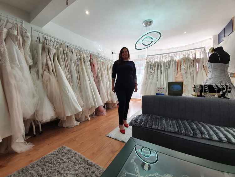 Cila Estevinho in her beautiful bridal boutique