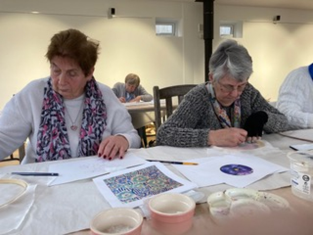 Jenny Bagnall and Jackie Crook doing their designs (Credit: Winnie Cameron)