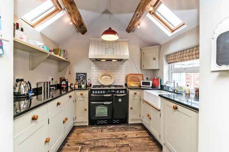 The kitchen boasts attractive exposed beams. Image: Gascoigne Halman Frodsham