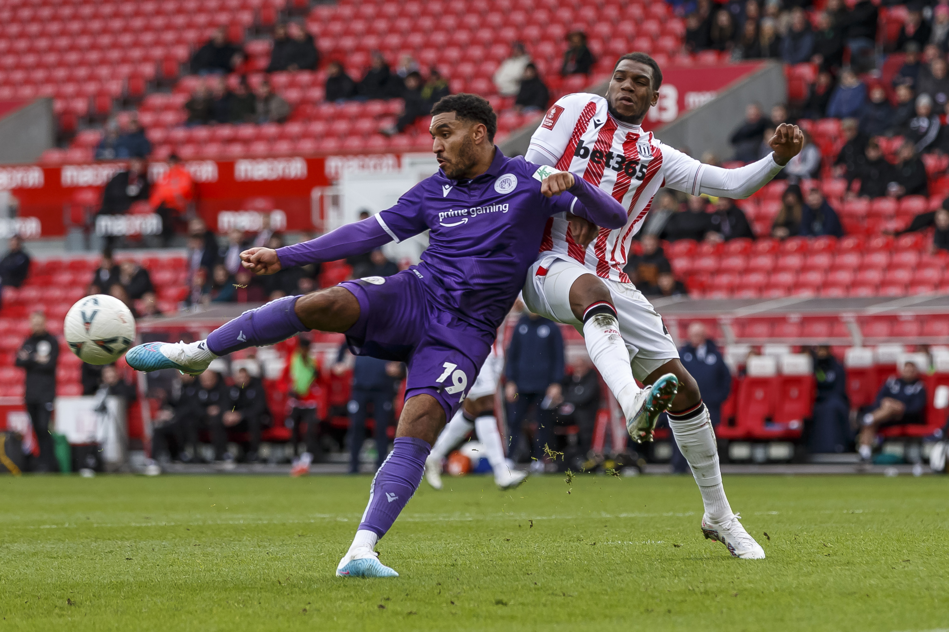 Stoke City v Stevenage 29 January 2023, Stoke on Trent - Emirates FA Cup Fourth Round Football - Stoke City v Stevenage. Jamie Reid of Stevenage and Dujon Sterling of Stoke City (photo by Daniel Chesterton)PLEASE NOTE All pictures licensed to Layth Yousif / Gooner Fanzine courtesy of Offside Sports Photography / Daniel Chesterton. Any unauthorised use will result in breach of copyright (C)