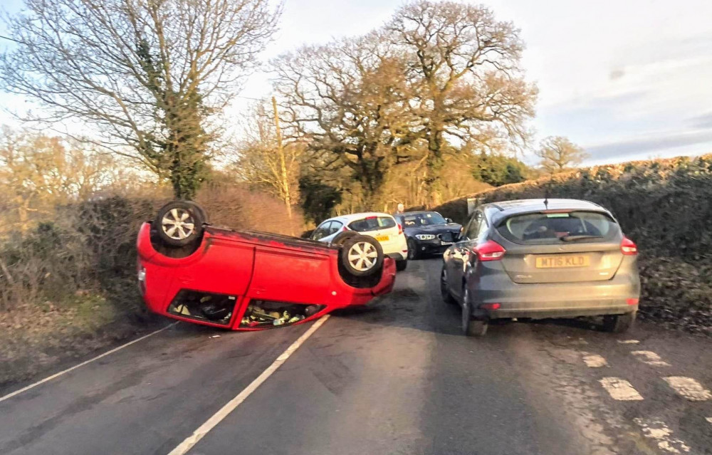 Car overturned yesterday but occupants escaped without injury 