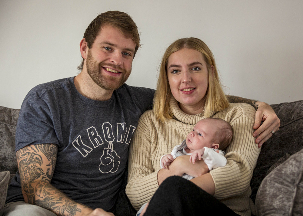 Ross, Abi and their new son Roman (four months). (Image - SWNS) 