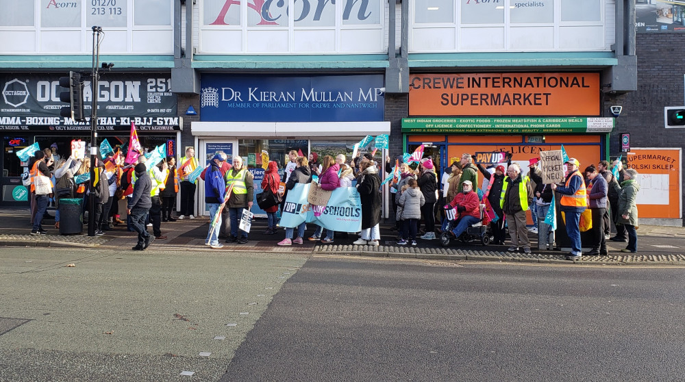 Dozens of teachers and supporters from across Cheshire East marched from Crewe Railway Station to Dr Kieran Mullan MP's office on Wednesday 1 February (LDRS).
