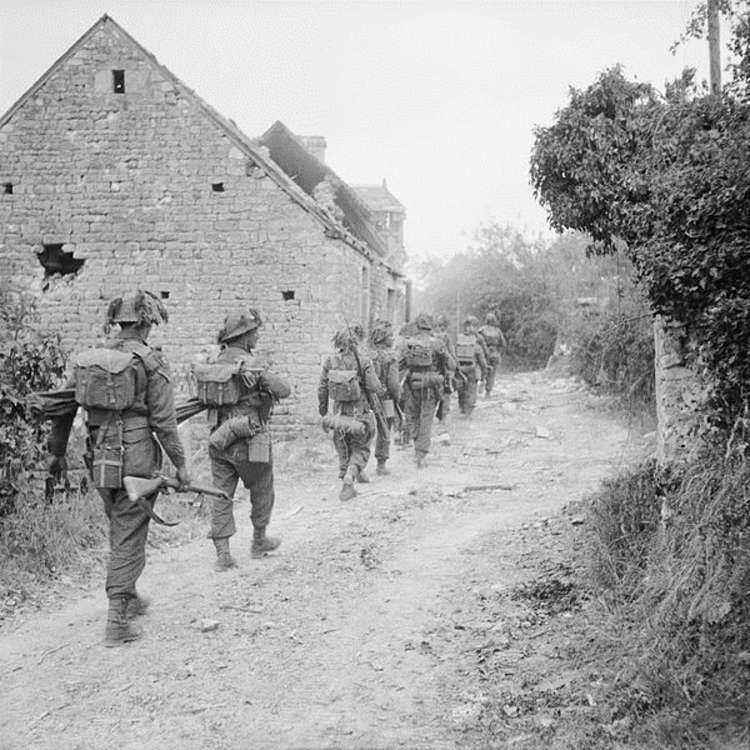Infantrymen of the Hallamshire Battalion, York and Lancaster Regiment in the village of Fontenay-le-Pesnel, Normandy, France, 25 June 1944