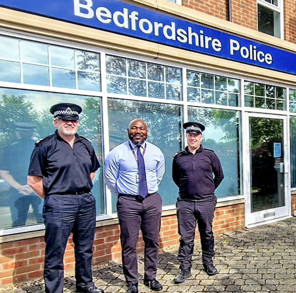 Bedfordshire Police and Crime Commissioner (PCC) Festus Akinbusoye flanked by two of his men. CREDIT: Beds Police 