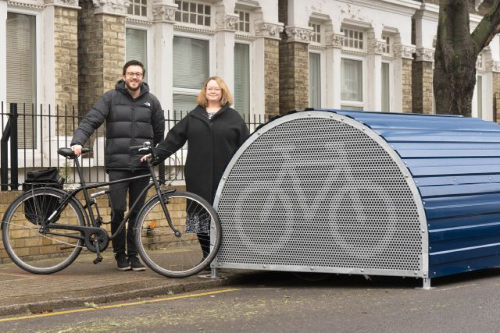 Cabinet Member for Transport Clare Fraser with Wandsworth's Active Travel Champion Jack Mayorcas at the borough's 100th bike hangar in Thirsk Road, Battersea (Credit: Wandsworth Council)