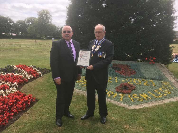 Glenn Mayes being presented with the centenary certificate by Royal British Legion County Chairman David Swann