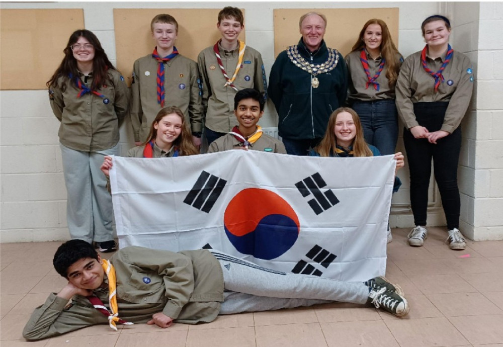 The nine scouts heading to South Korea pictured with former Mayor of Kenilworth Cllr Peter Jones (image supplied)