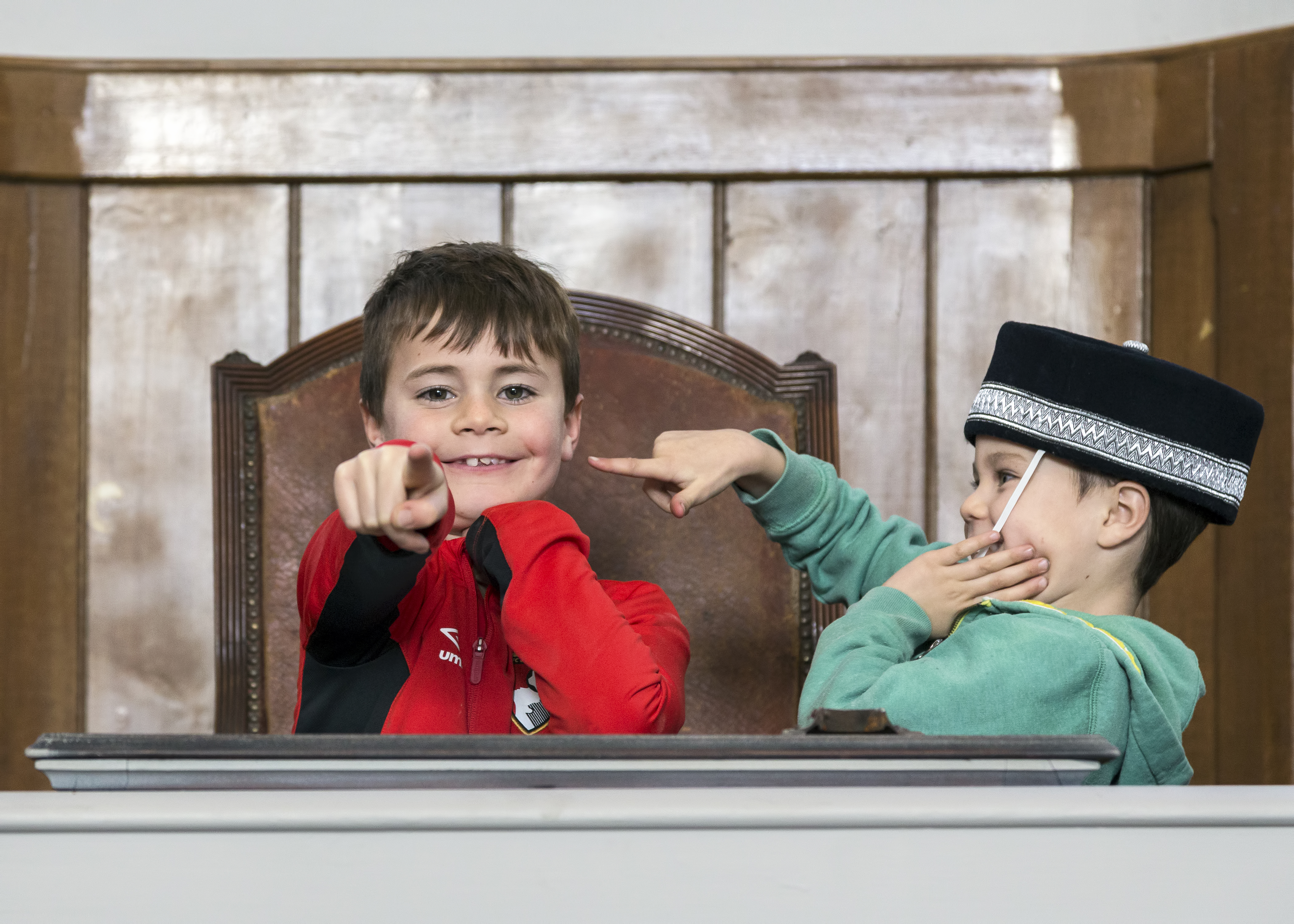 Children have fund in the courtroom at Shire Hall Museum