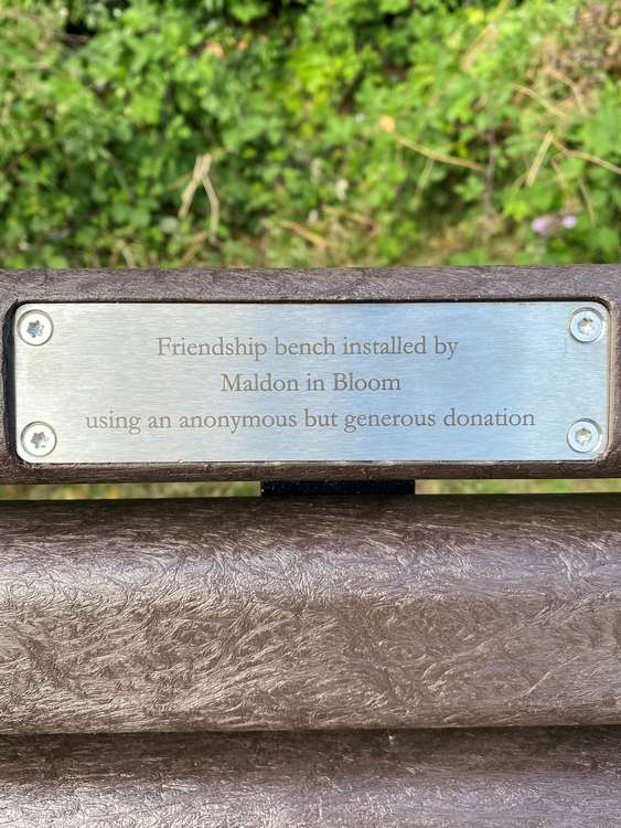 The plaque on the new bench