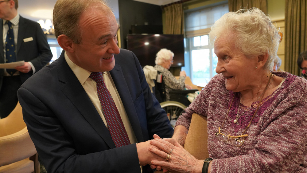 Kingston and Surbiton MP Ed Davey receives a warm welcome from resident Rosemary (Credit: Royal Star & Garter)