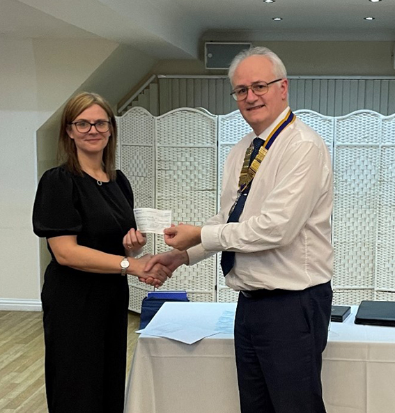 Haley Martin, event co-ordinator at Belhus Cricket Club receives a cheque from David Westcott.