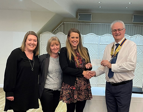 Warrior Twins mum Jenna Whyman collecting cheque with Rebecca Love and Jennie O’Donnell from David Westcott.