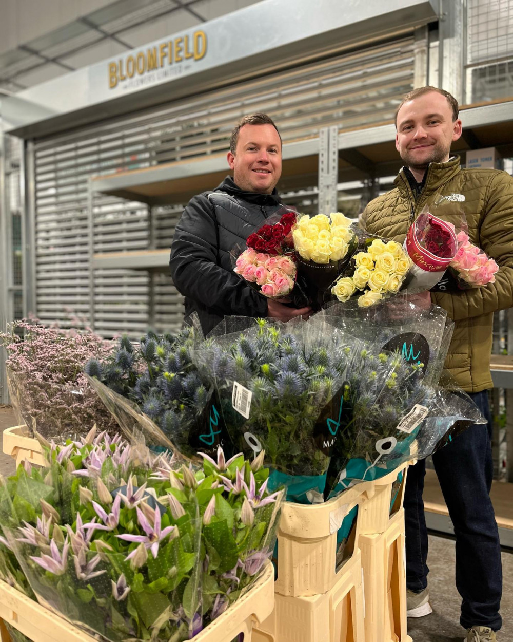 Michelle’s son Sam and his colleague Justin, just prior to roses donated by Bloomfields being boxed up for delivery. (Credit: New Covent Garden Market)