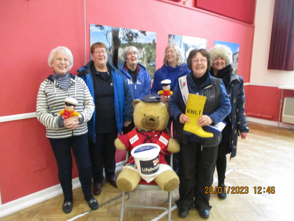 RNLI volunteers pictured at the recent SOS table-top sale in beer